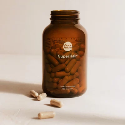 Moon Juice SuperHair bottle and supplements