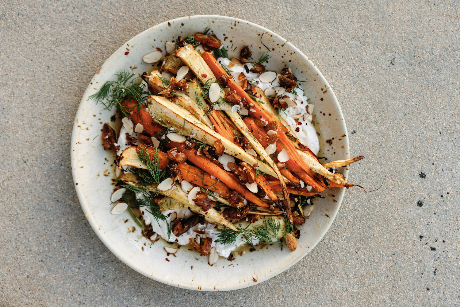 charred carrots with honey-lime yogurt, dates, and almond