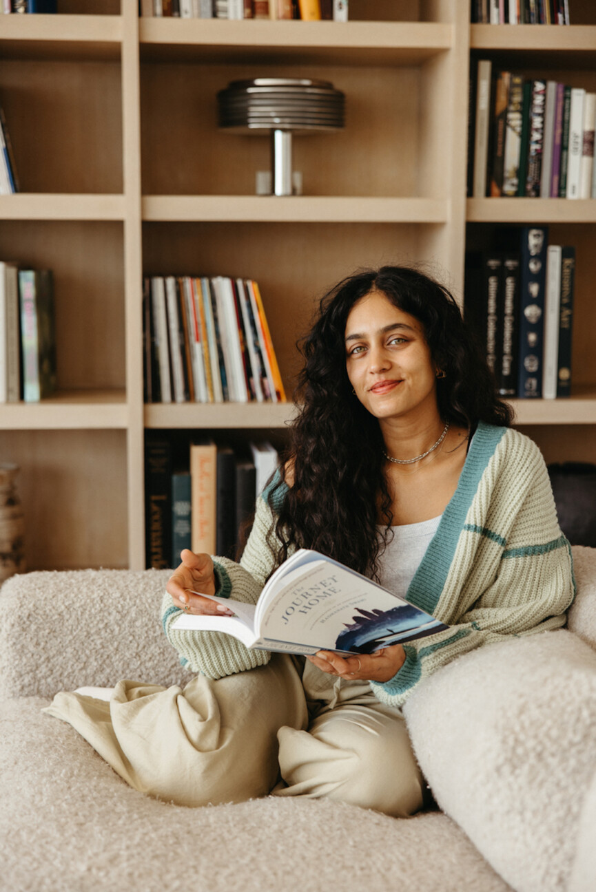 Woman reading on couch_castor oil packs