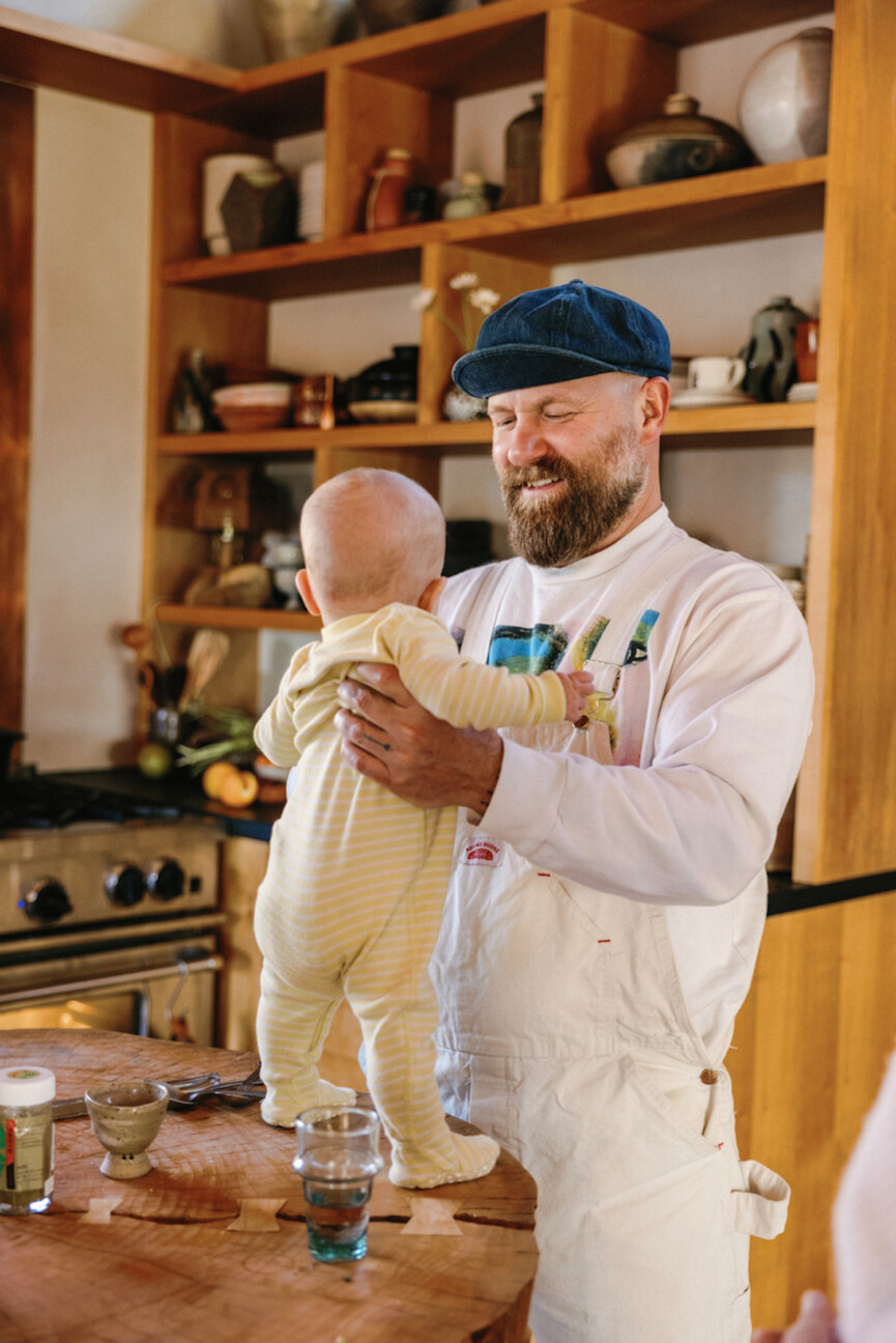 Dad holding baby.
