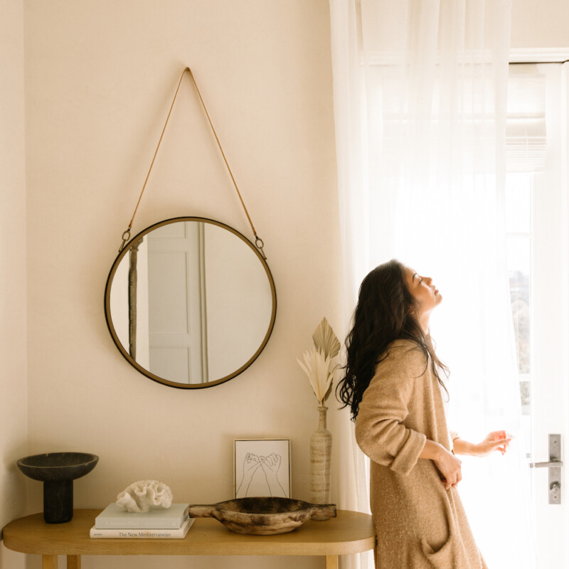 woman looking out window_luteal phase