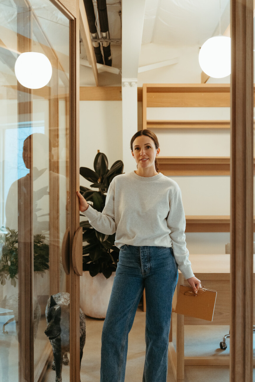 Adriene Mischler standing in her Austin, Texas office.