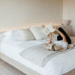 Woman reading on bed_luteal phase