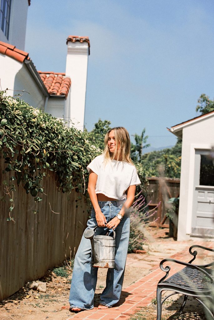 Woman wearing fall 2023 denim trends outside.