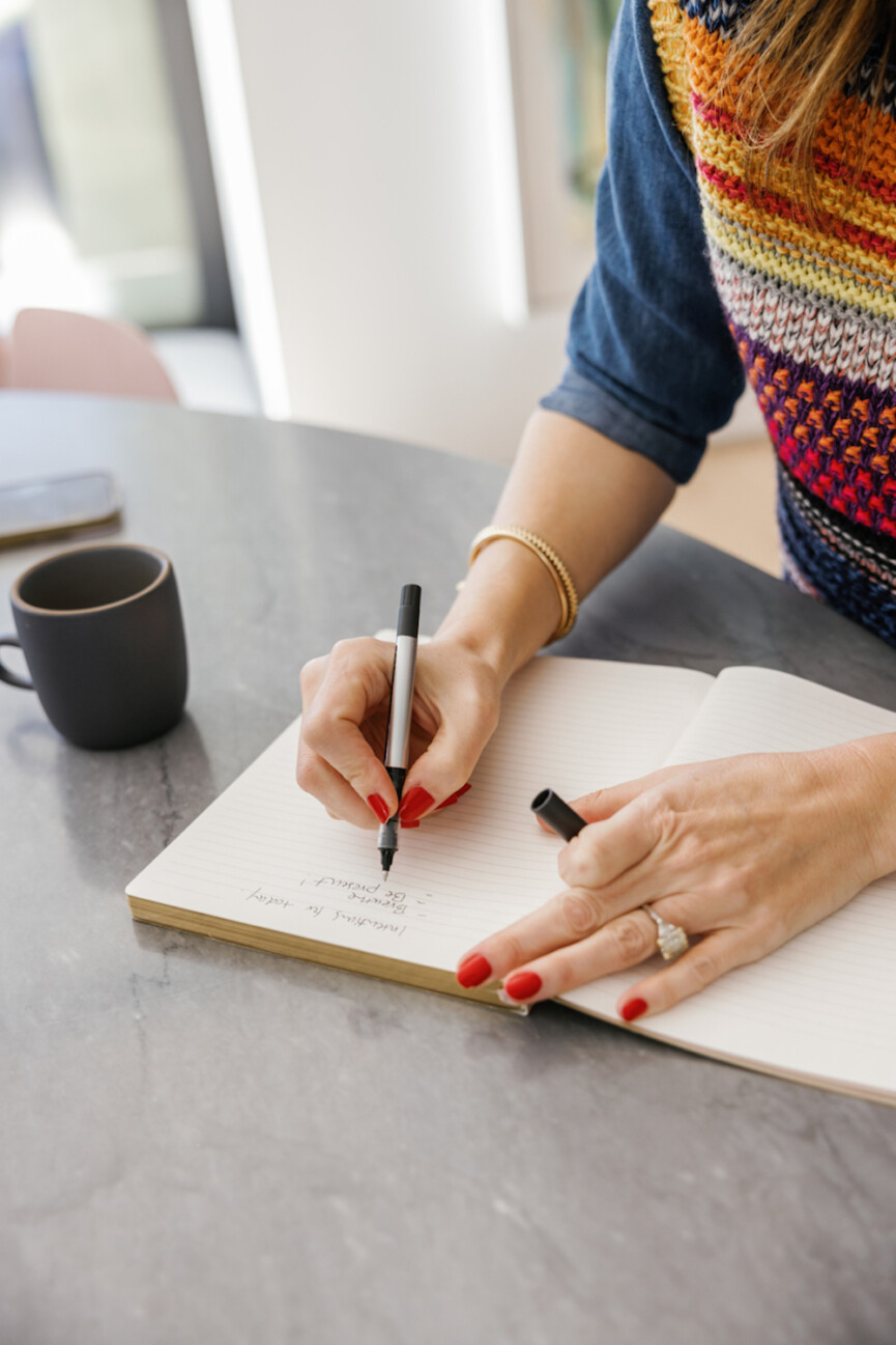 Woman writing_cycle syncing caffeine