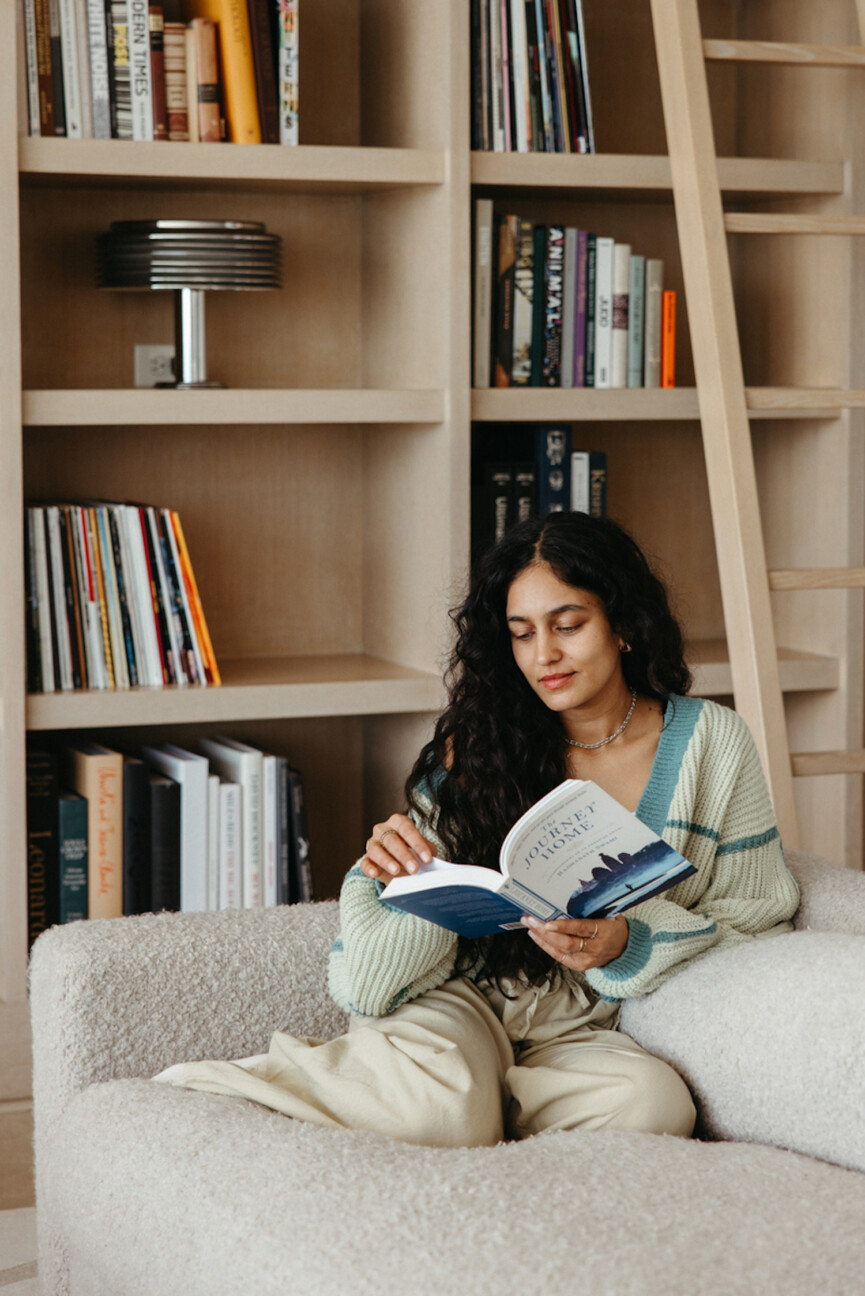 Woman reading on the couch.