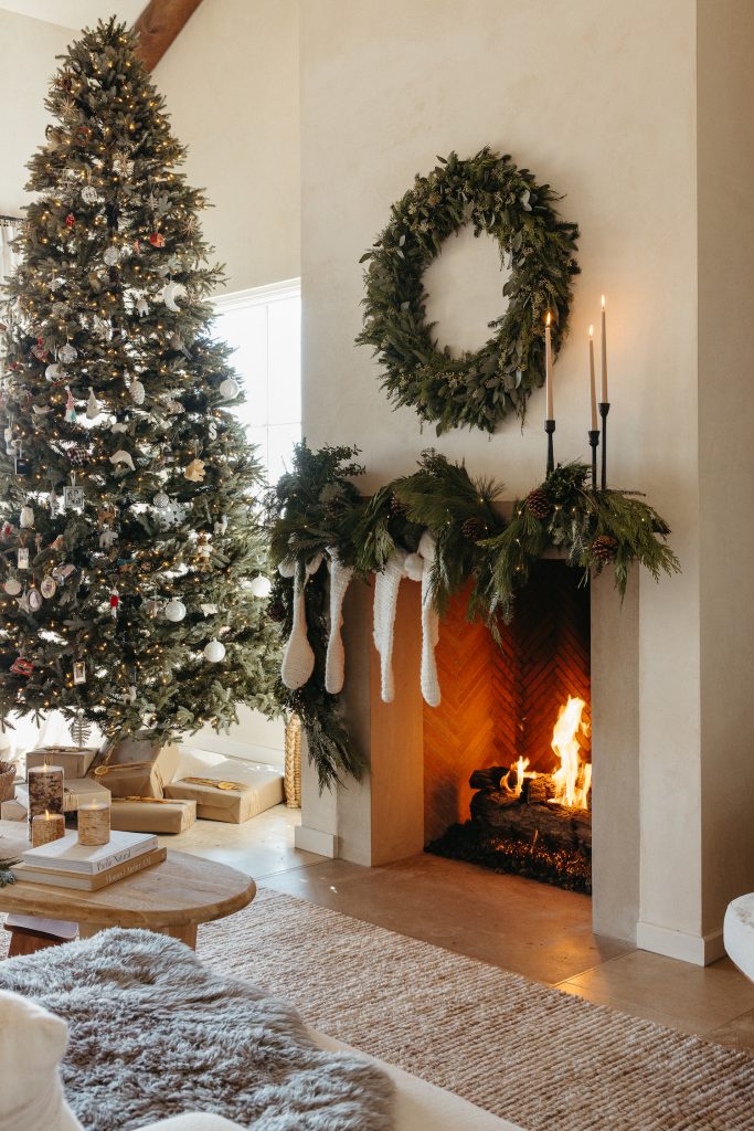 Camille Styles Holiday Decor 2023-Christmas Mantel with evergreen garland and casa zuma holiday wreath