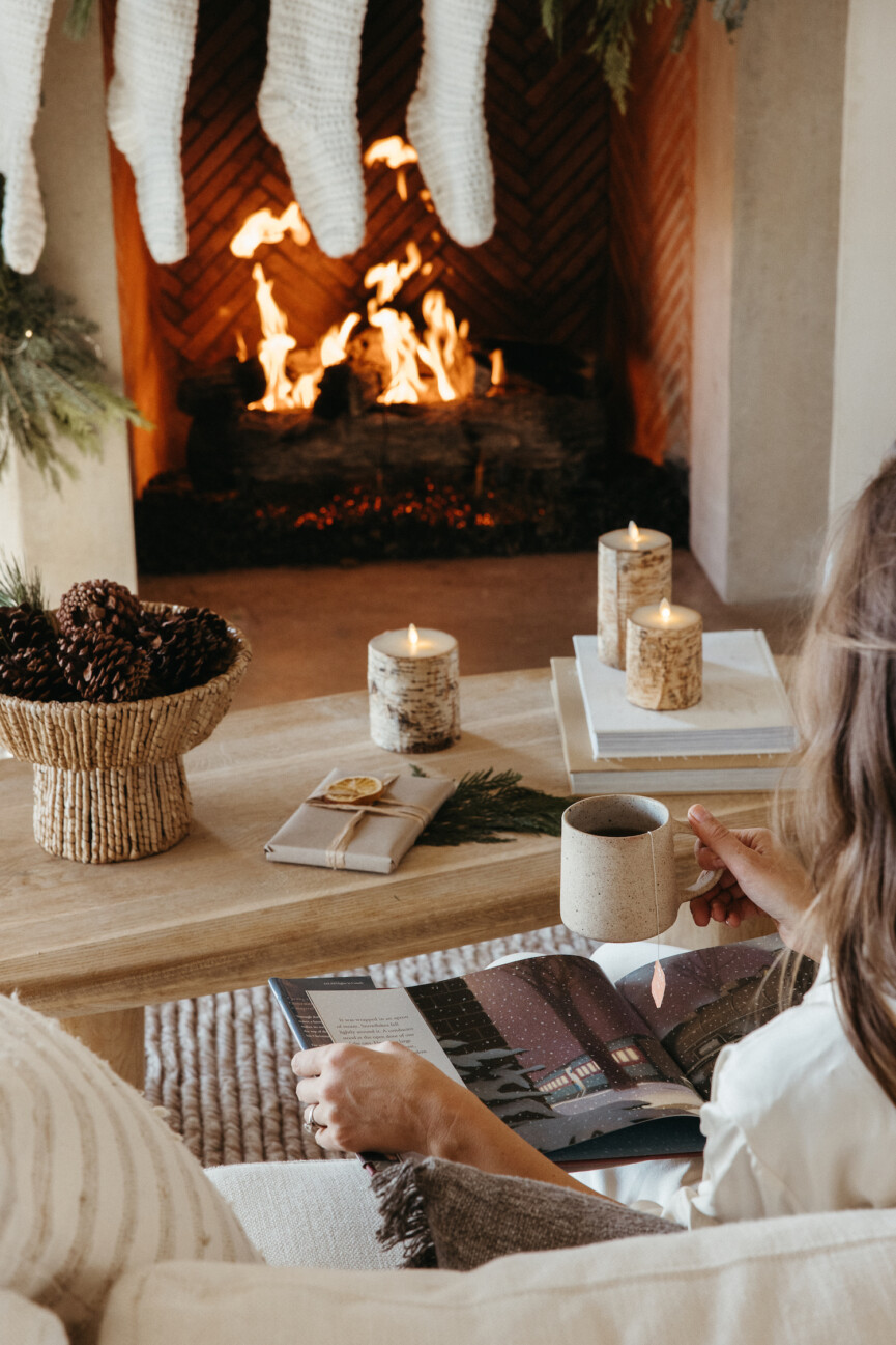 Camille Styles Holiday Decor 2023-mug in front of fire