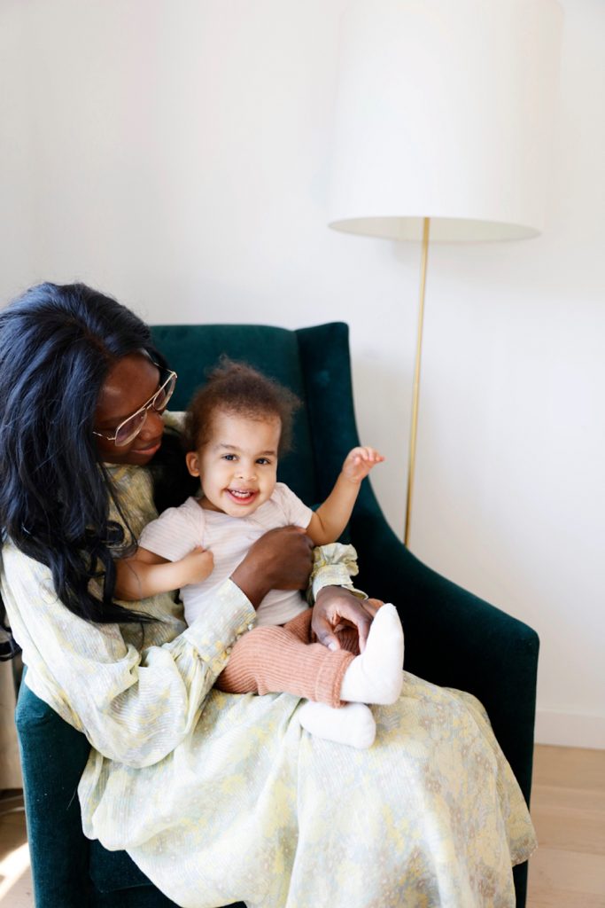 Mother holding daughter.
