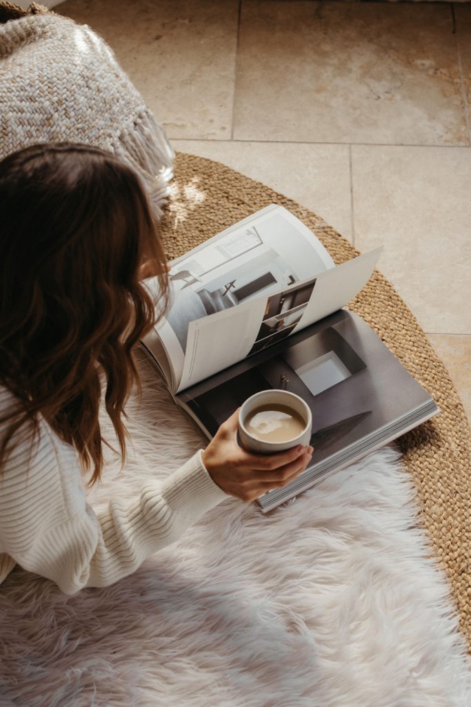 Woman reading having an anti-hustle holiday.