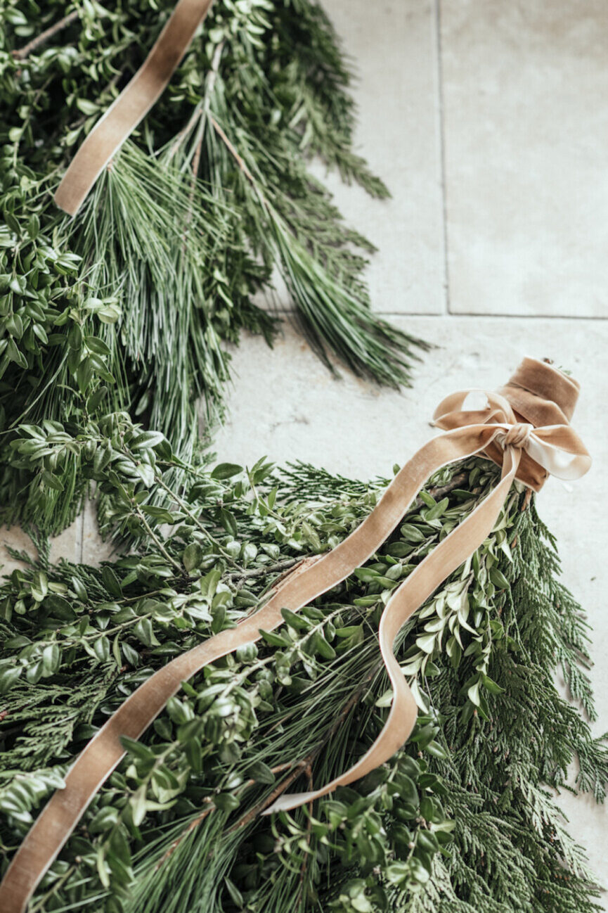 Scandinavian inspired holiday evergreen swag — front porch christmas decorating ideas