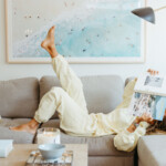 Woman reading on couch.