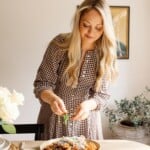 Woman garnishing pasta