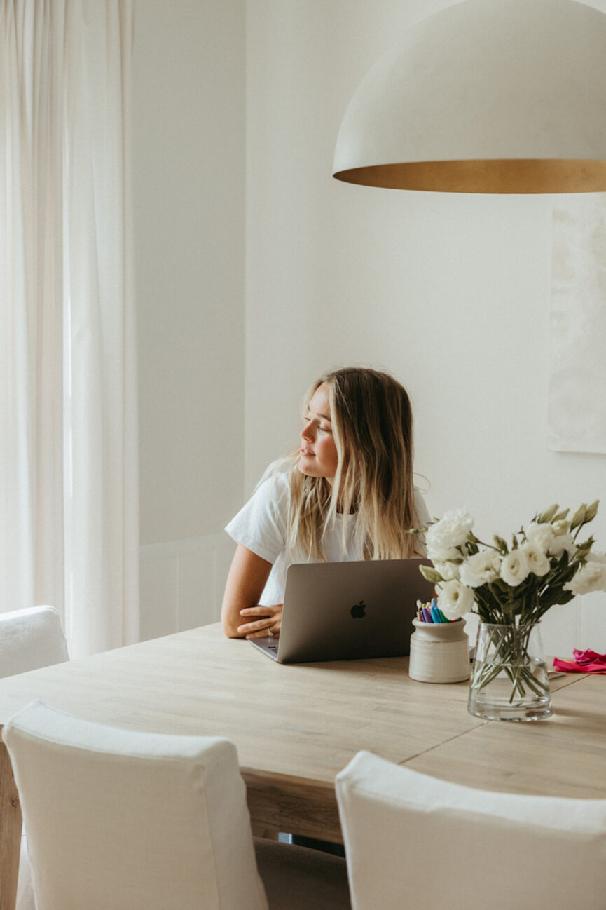 Woman working on laptop.