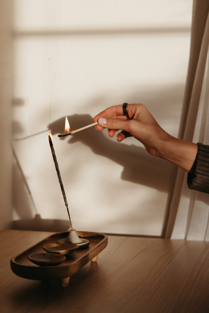 Lighting incense.