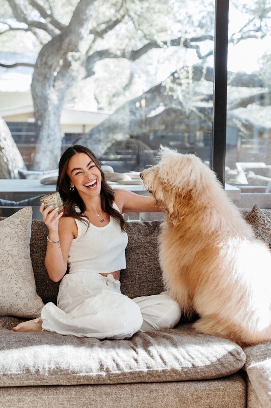 Woman petting dog.