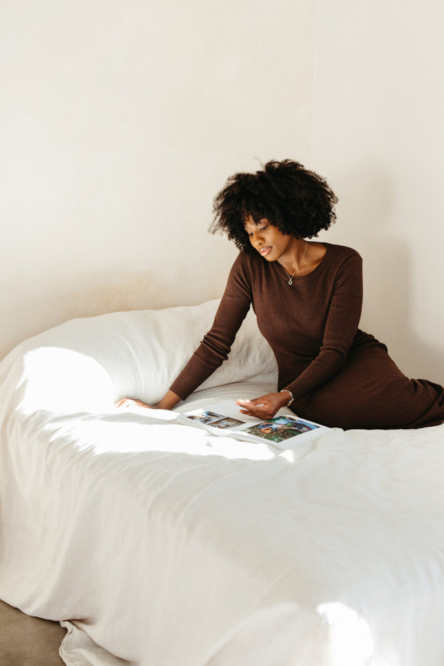 Woman reading on bed.
