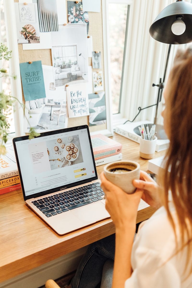 woman organizing photos on the computer with cup of coffee_chatgbt prompts for health