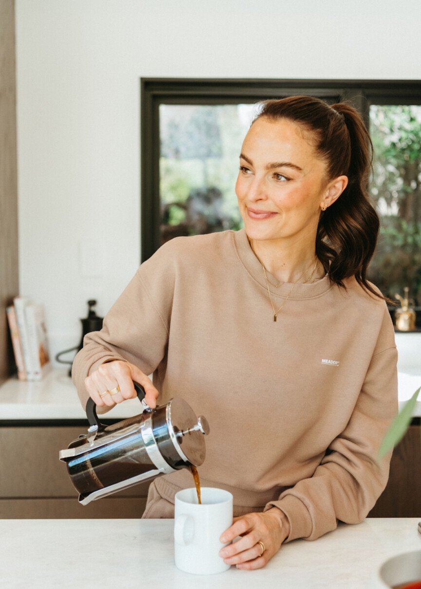 Megan Roup pouring coffee.