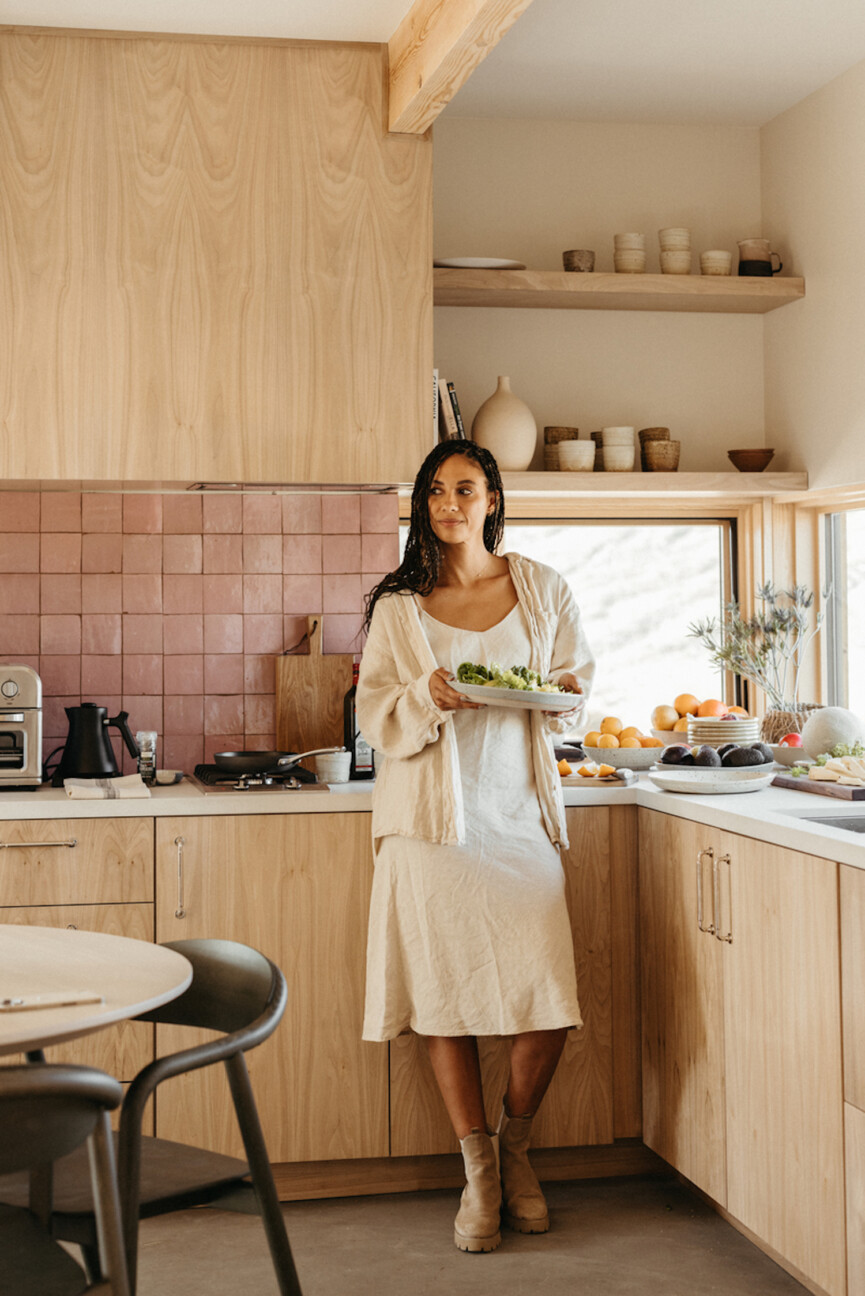 Woman in kitchen.