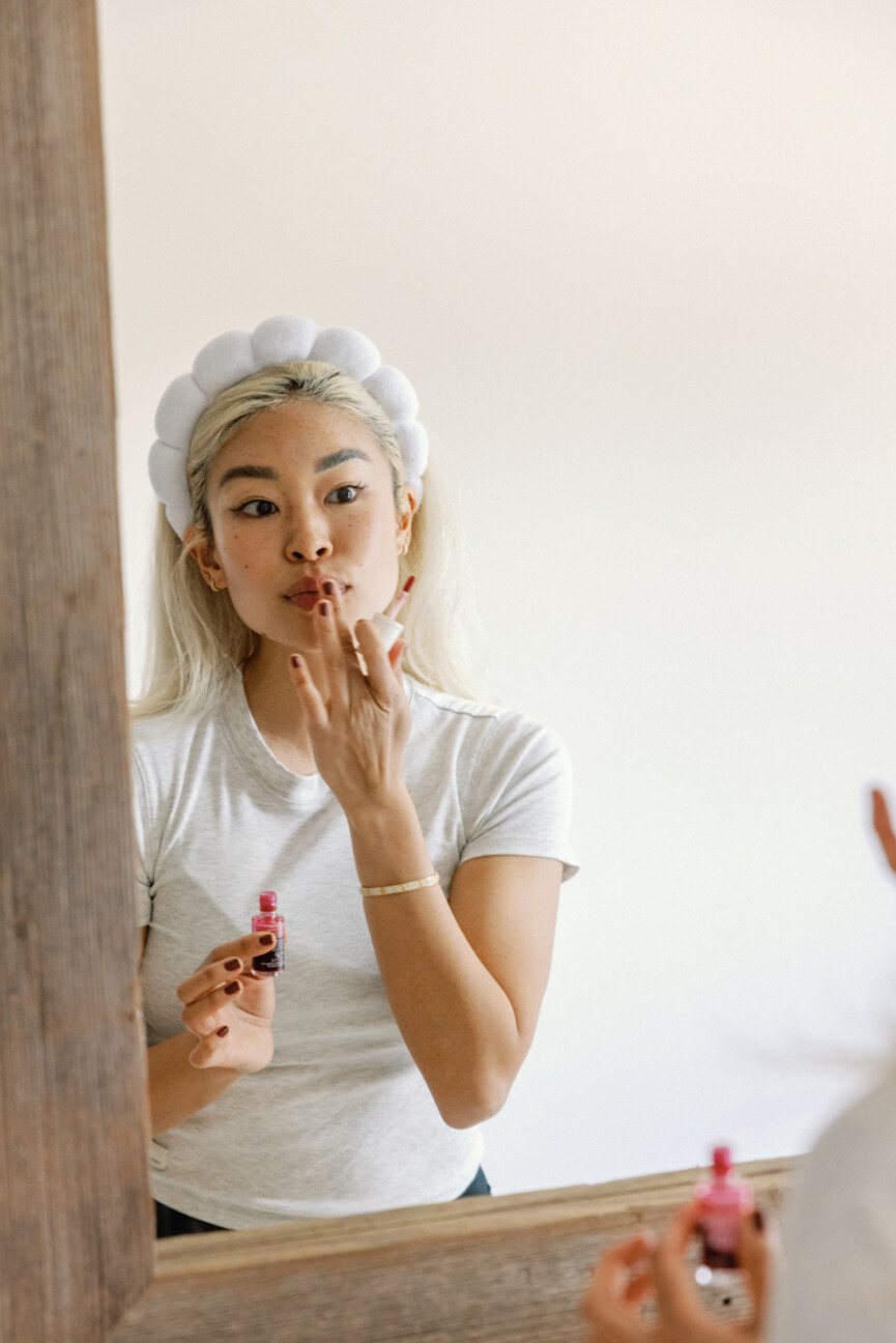 Remi Ishizuka applying lip treatment