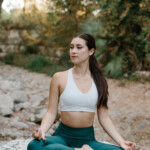 Woman doing yoga_how to build muscle and lose fat