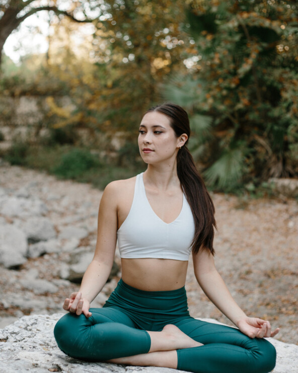 Woman doing yoga_how to build muscle and lose fat