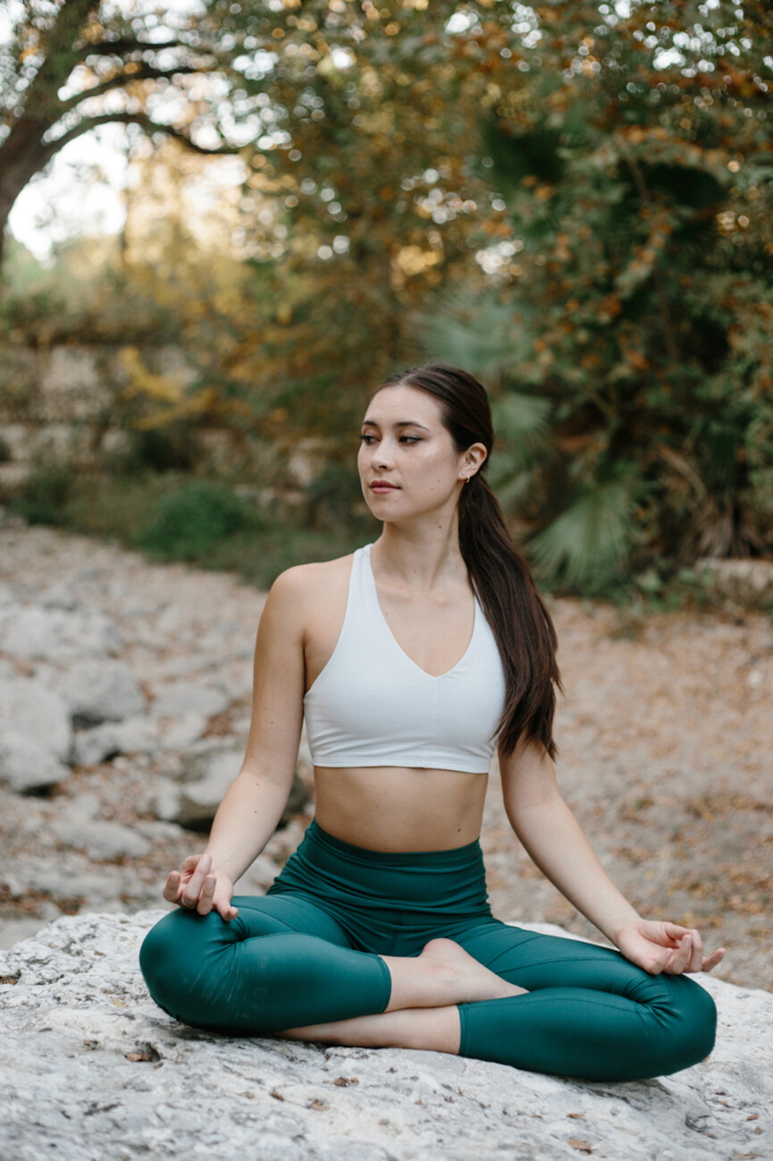 Woman doing yoga_how to build muscle and lose fat