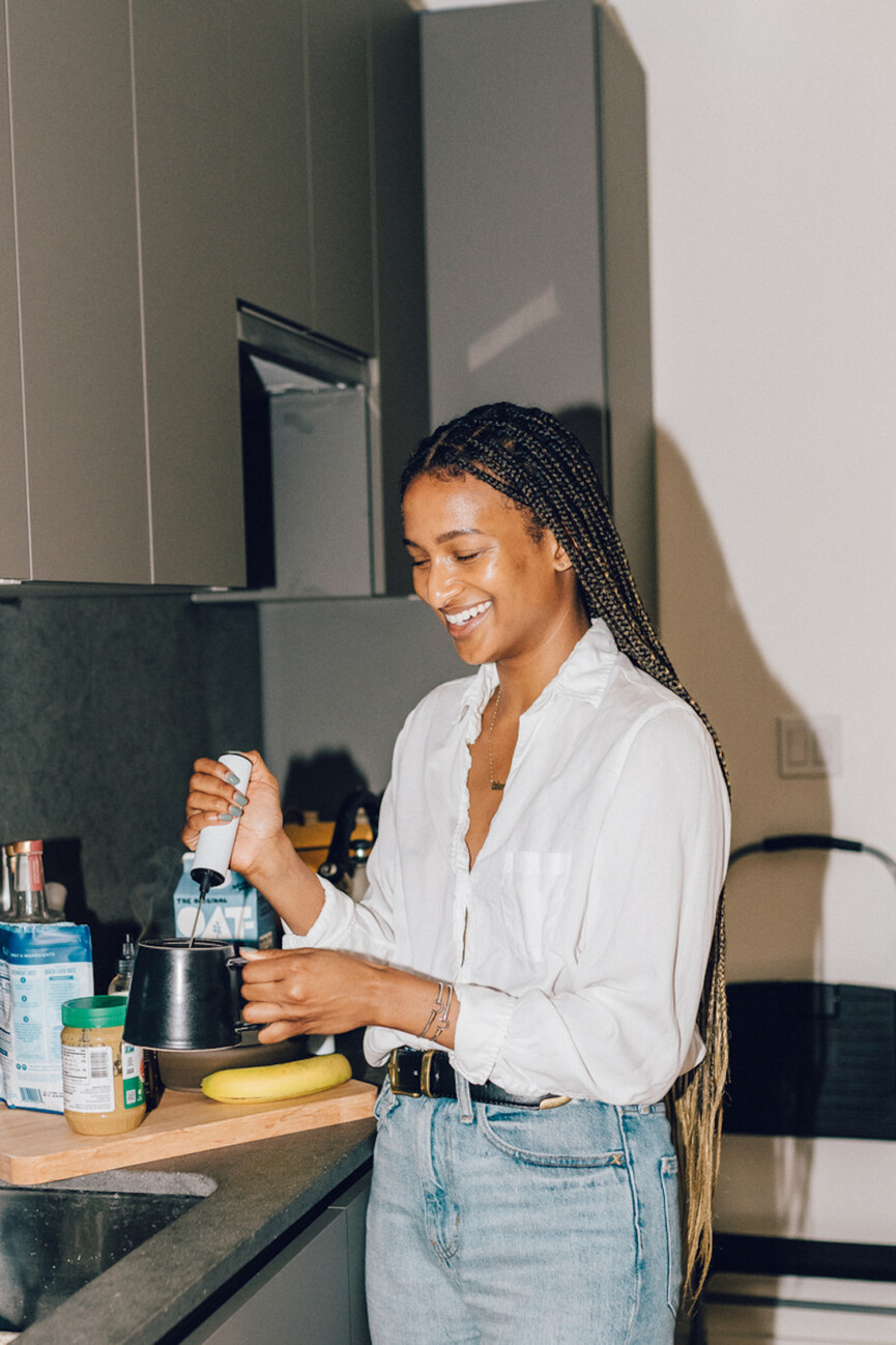 Woman making coffee.