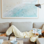 Woman reading on couch.