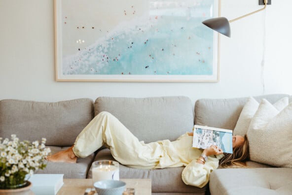 Woman reading on couch.