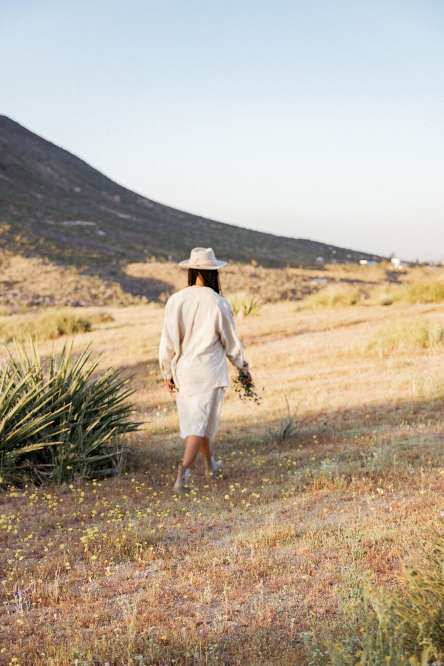 Woman walking in field.