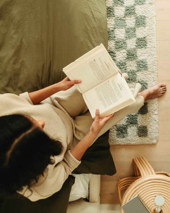 Woman reading book.