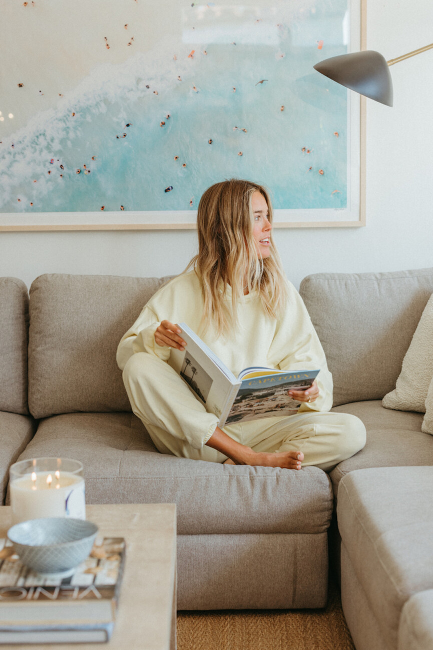 Woman reading on couch.