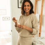 Woman using best bronzing drops