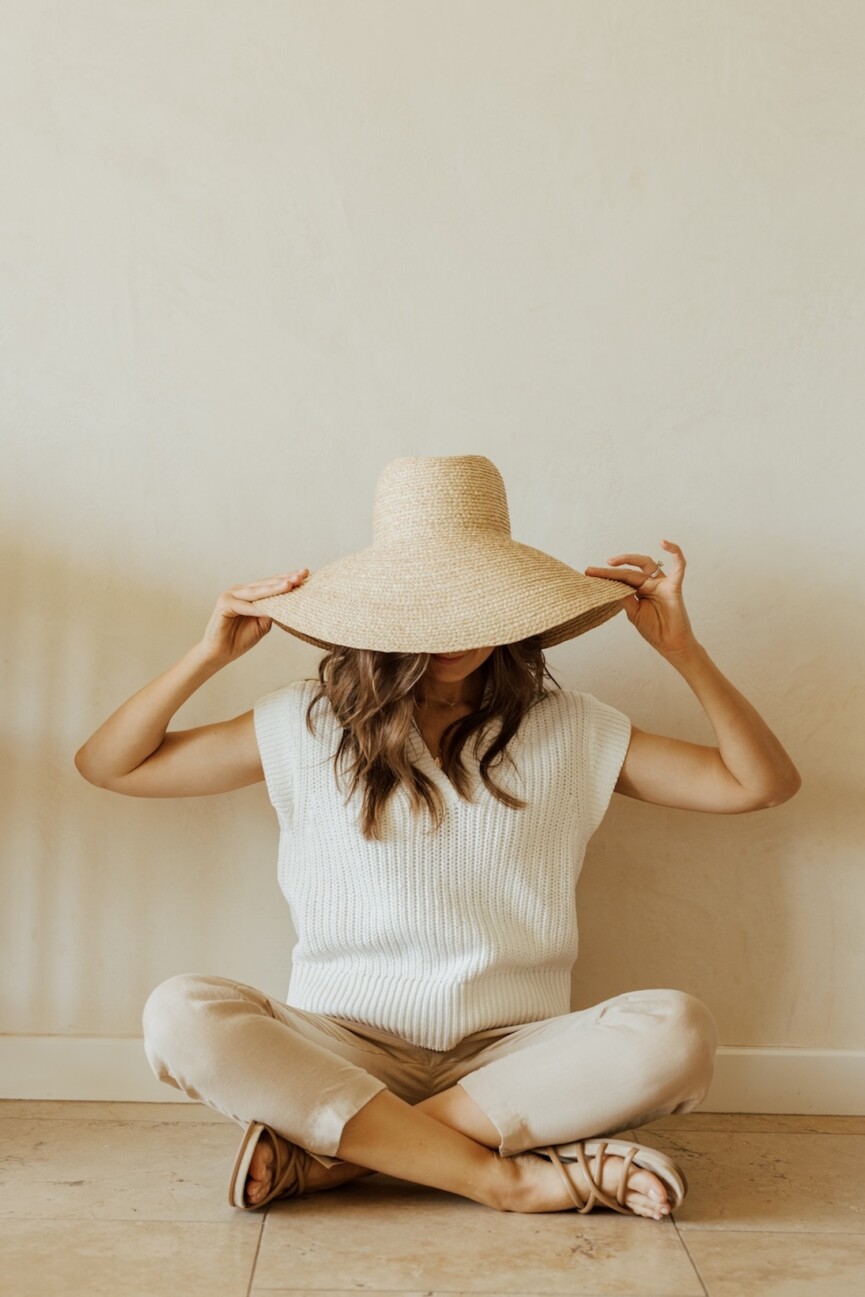 Woman wearing sun hat.