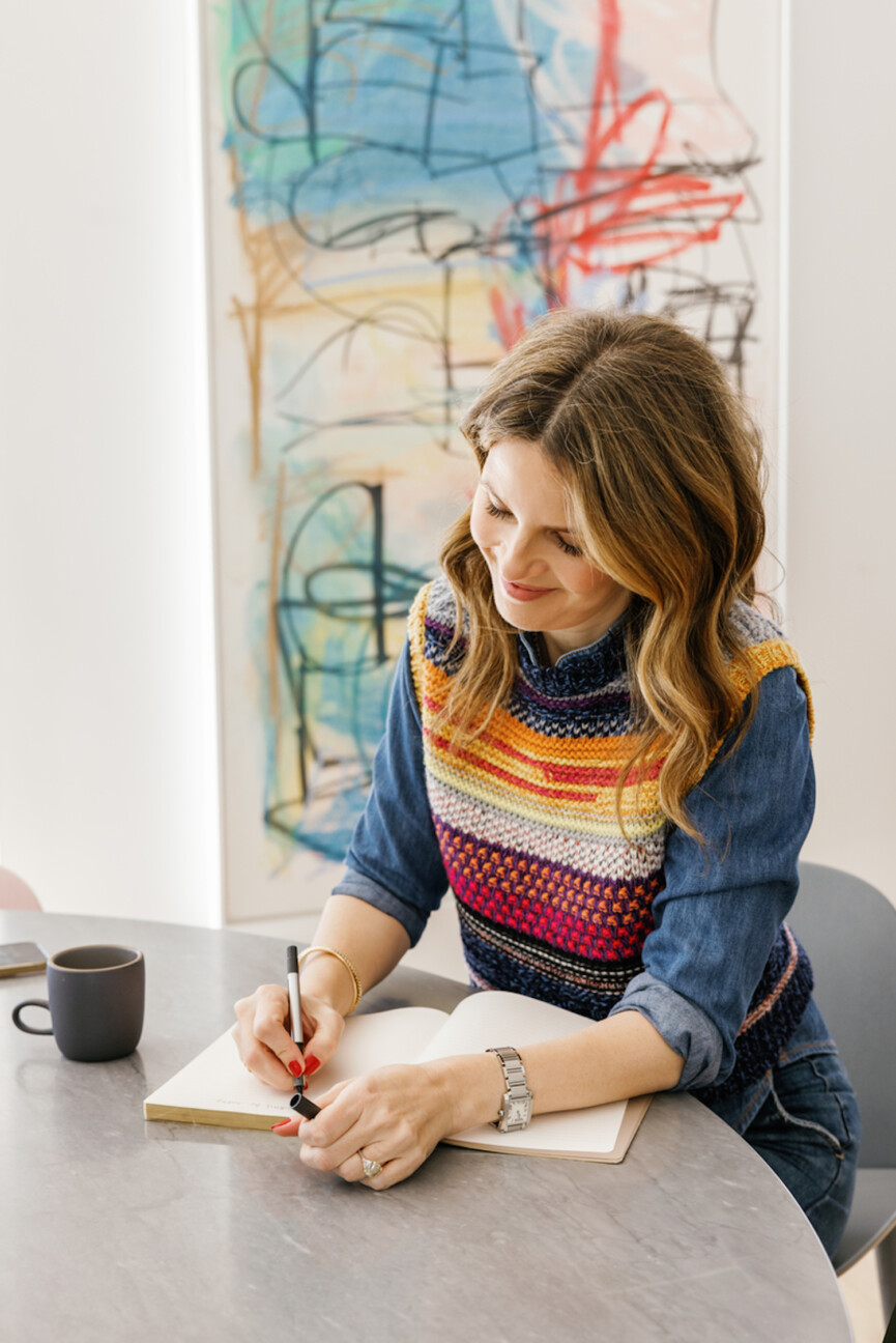 Woman writing in notebook