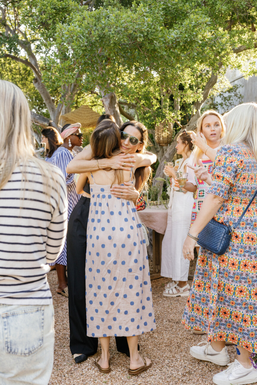 Women hugging at party.