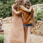 Mother daughter embrace_breast self exam