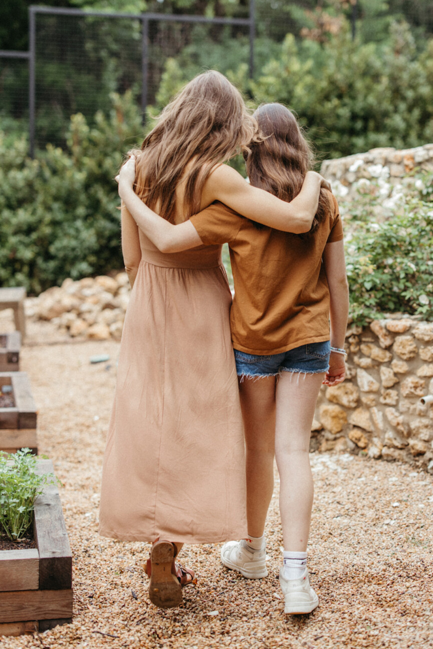 Mother daughter embrace.