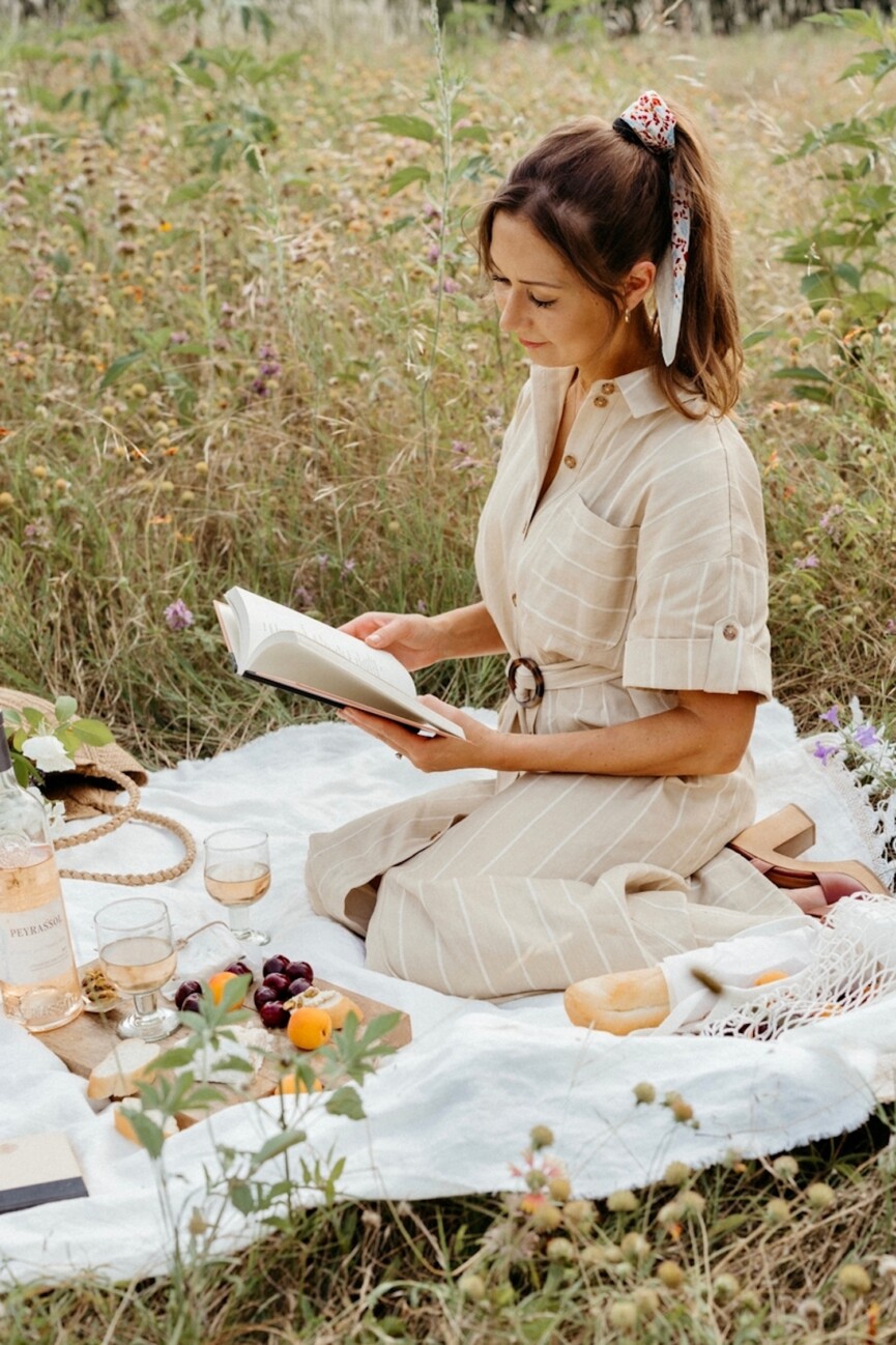 Woman reading outside.