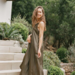 Camille Styles wearing long, elegant dress.