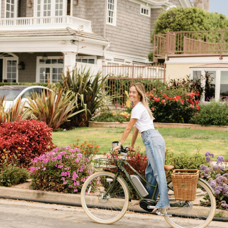 woman biking outside nostalgic 90s summer vibes
