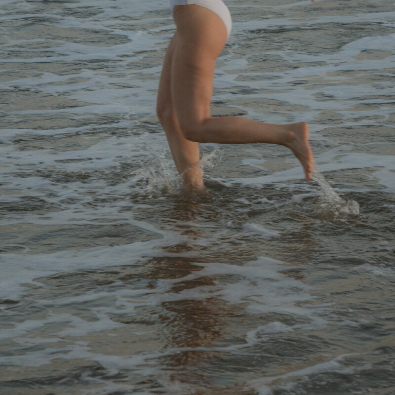 Woman running in water.
