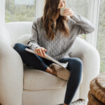 woman reading and drinking coffee
