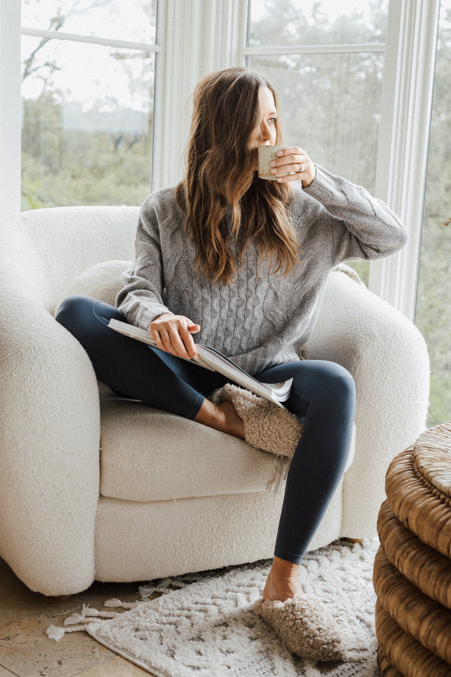 woman reading and drinking coffee