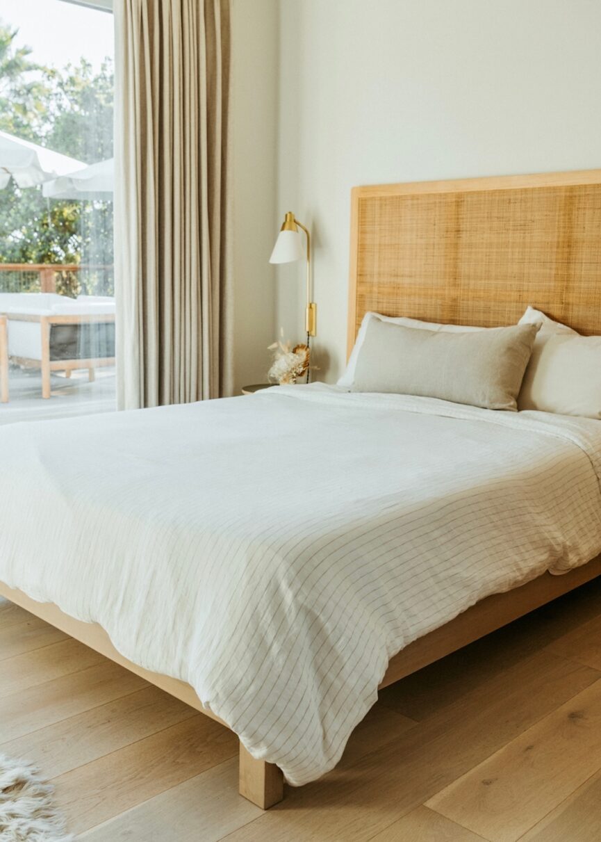 Natural, light wood bed.