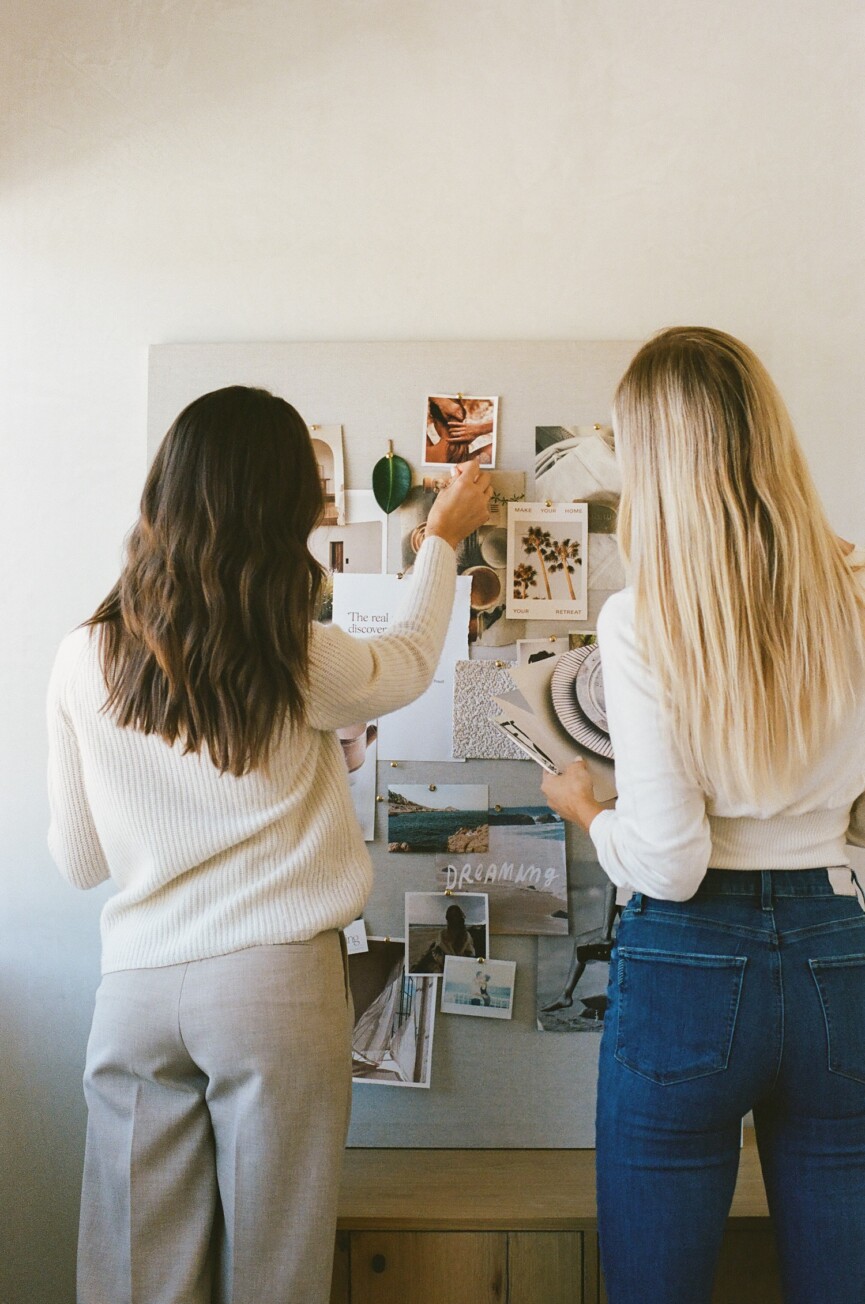 Mari Llewellyn and Camille Styles with vision board