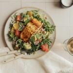 citrus salmon salad with avocado, yellow shirt