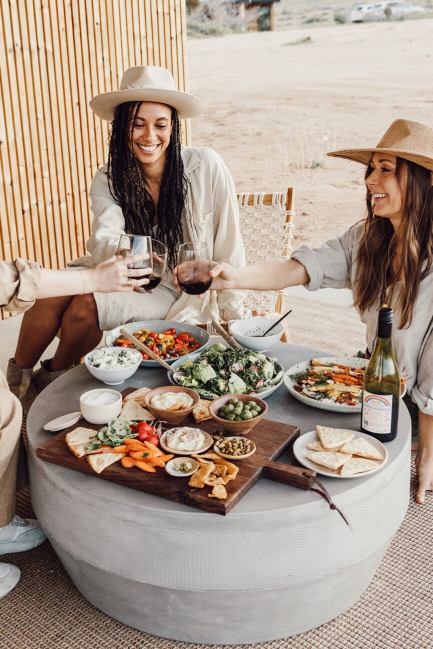 Friends laughing at happy hour.